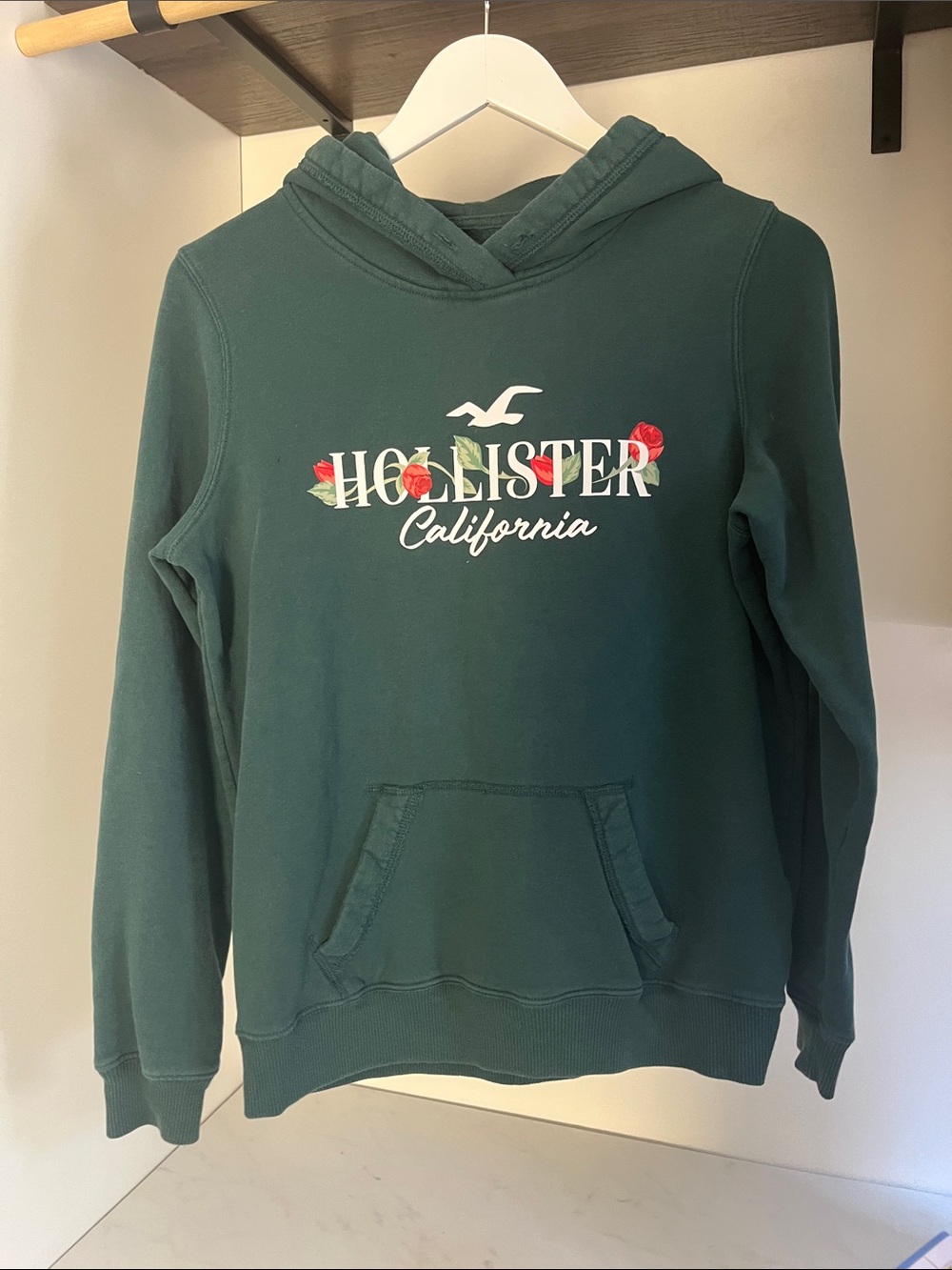 Hollister Green Hoodie with Floral Logo/ small defect